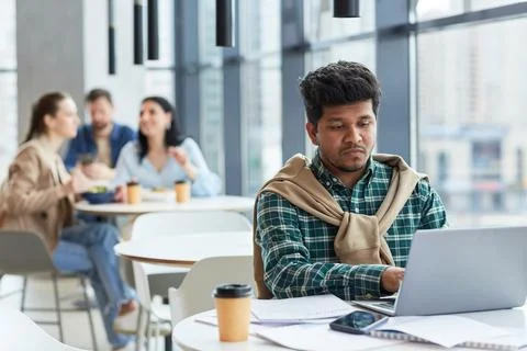 Man Working Remotely at Cafe Table Stock Photos