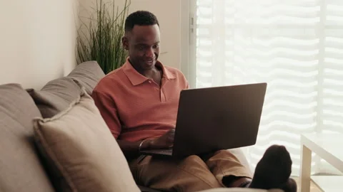 Man Working Remotely From Home on Laptop in cozy setting Stock Footage 307202286