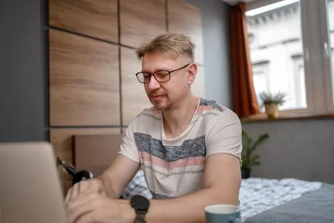 Man Working Remotely On Laptop Stock Photos