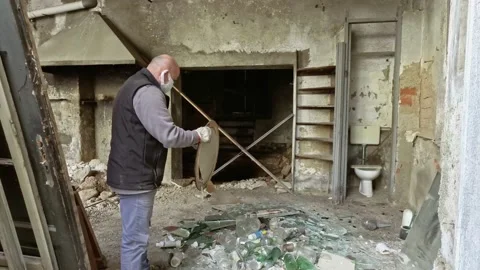 A Man Working at Ruins Of Abandoned Building While Wears a Medical Masks Stock Footage 143190122