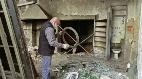 Man Working at Ruins Of Abandoned Building While Wears a Medical Masks Stock Footage 143190170