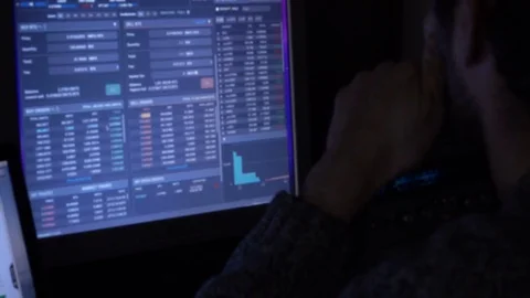 Man Working on Screen with Charts Видео 84205492