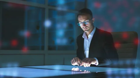 The man working with a sensor display on the hologram background Stock Footage 100577664