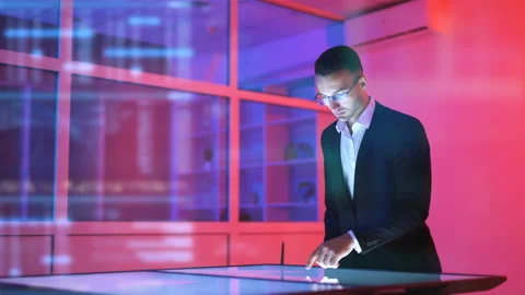 The man working with a sensor screen on the hologram background Video stock 100581764