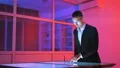 The man working with a sensor screen in the office 4k or 4k+ Resolution