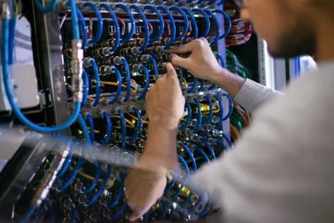 Man Working with Server Cabinet 스톡 사진