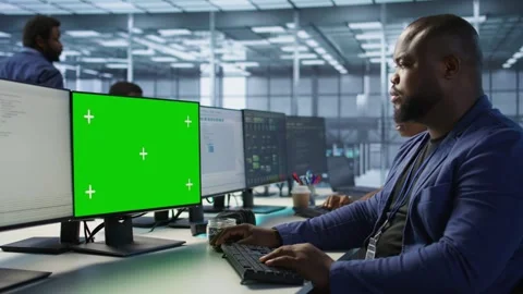 Man working in server farm using green screen computer Stock Footage 319576796