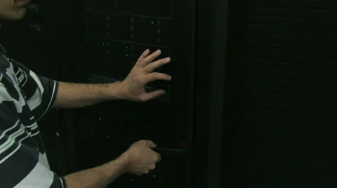 Man working in server room Видео 29931034