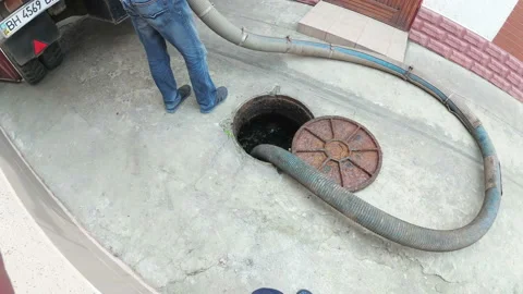 Man Working with Sewage Machine. Sucking Dirt Stock Footage 94829608