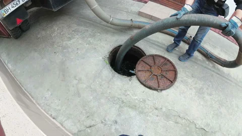 Man Working with Sewage Machine. Sucking Dirt Stock Footage 94865491