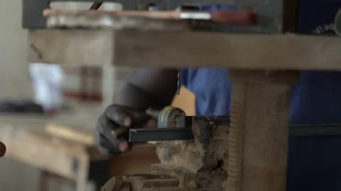 Man working in shop with drill and metal Stock Footage 219762510