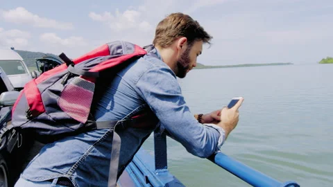 Man working on smart phone, online business success, blogging or remote on ferry Video stock 201095397
