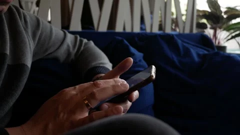 Man working in smartphone app. Networking or social media at cafe. Male hands us Stock-Footage 285067201