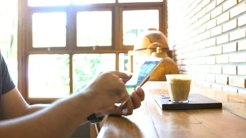 Man working on smartphone in cafe. Stock Footage 112911230