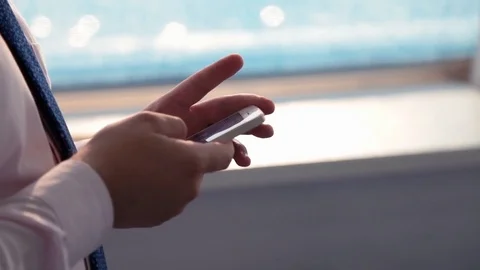 A man is working on a smartphone in the office Stock Footage 76000199