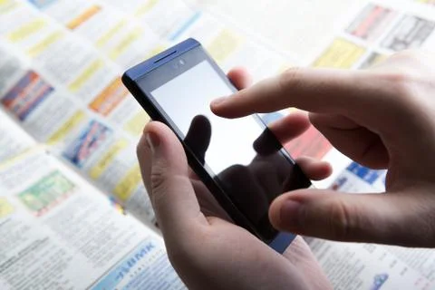 Man working on a smartphone in office Foto stock
