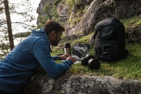 Man is working on the stone in the forest Stock Photos