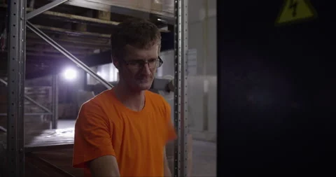 Man Working In Storage Room Stock Footage 142892046