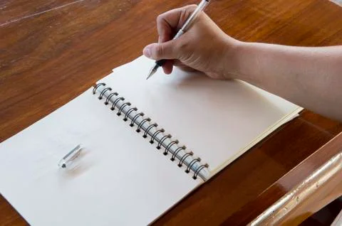Man working table book pen booklet concept Stock Photos