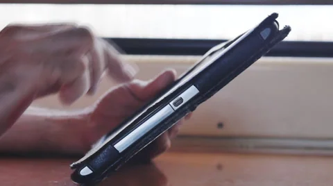 A man working on a tablet in the car Stock Footage 63325629