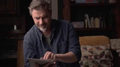 Man working with tablet in home office Stock Footage 150214224