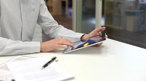 Man working on tablet pc in start-up office Stock Footage 43743336