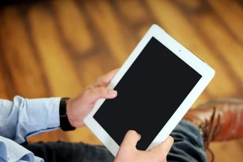 Man working on a tablet. Stock Photos