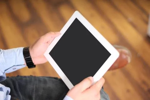 Man working on a tablet. Stock Photos