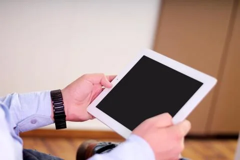Man working on a tablet. Stock Photos