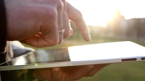 Man Working on a Tablet on The Sunset Background Stock-Footage 64874035