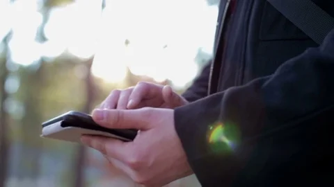 A man working on a tablet at sunset Stock Footage 73412370