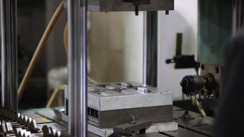Man working taking a casting part from the machine, industrial safety first Stock Footage 297736428