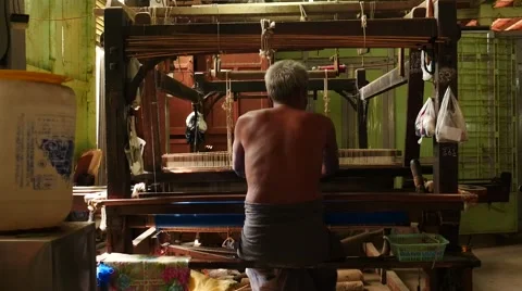Man working on textile machine indoors - Myanmar, Mandalay city Stock Footage 61204652