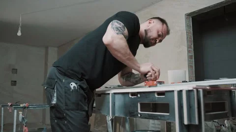 Man working on tile installation in slow motion at construction site Video stock 307039594