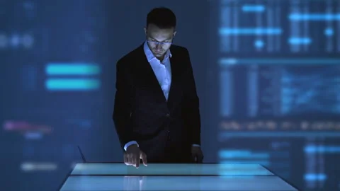 The man working with a touchscreen display on the hologram background Stock Footage 100564467