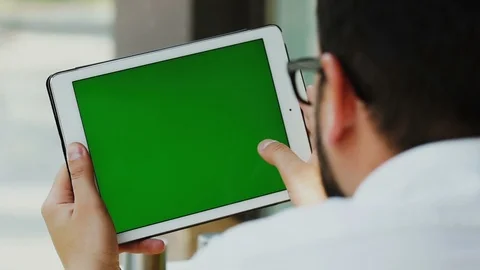 Man working on touchscreen pad with chromakey Stock Footage 112990713