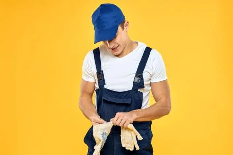 Man in working uniform documents rendering of services delivery service yellow Stock Photos