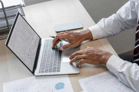 Man working by using a laptop computer Hands typing on keyboard Man workin... Foto stock