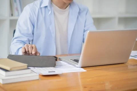 Man working by using a laptop computer Hands typing on keyboard. writing a... Stock-Fotos
