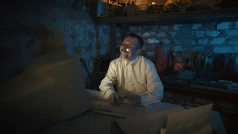 Man Working on Vintage Computer at Night Stock Footage 340483378