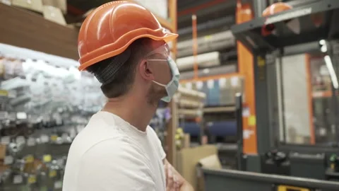 Man working in a warehouse, inventory of a store, and operates a forklift. A Video stock 138519960