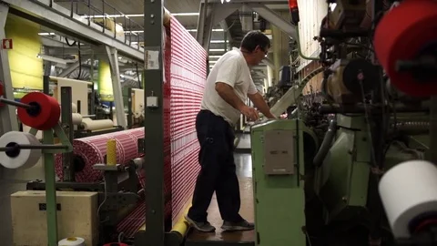 Man working on a weaving machine. Stock Footage 72592688