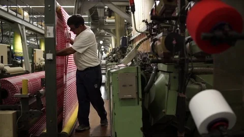 Man working on a weaving machine. Stock Footage 72594058
