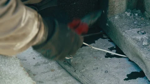 Man working with wires at a construction site Stock Footage 273151993