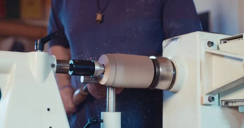 Man working on a wood lathe creating art - slow motion macro shot Stock Footage 90803111