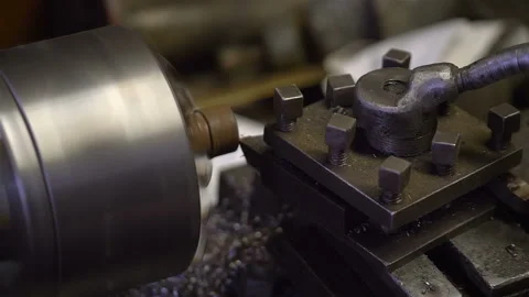 Man working in a workshop on lathe in slow motion 180fps Stock Footage 126583788