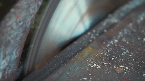 Man working in a workshop on saw in slow motion 180fps Stock Footage 109185103