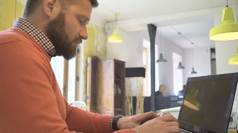 Man working, writing, typing on social media, on laptop, close profile shot Video stock 73292506