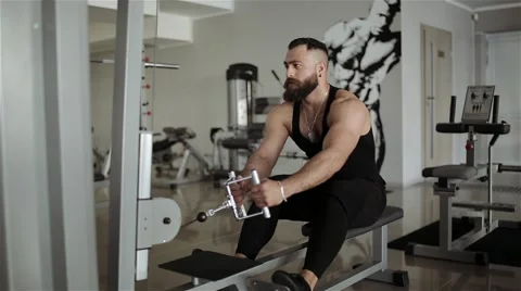 Man workout with power simulator in the gym Stock Footage 56635857