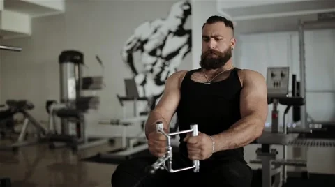 Man workout with power simulator in the gym Stock Footage 56635872